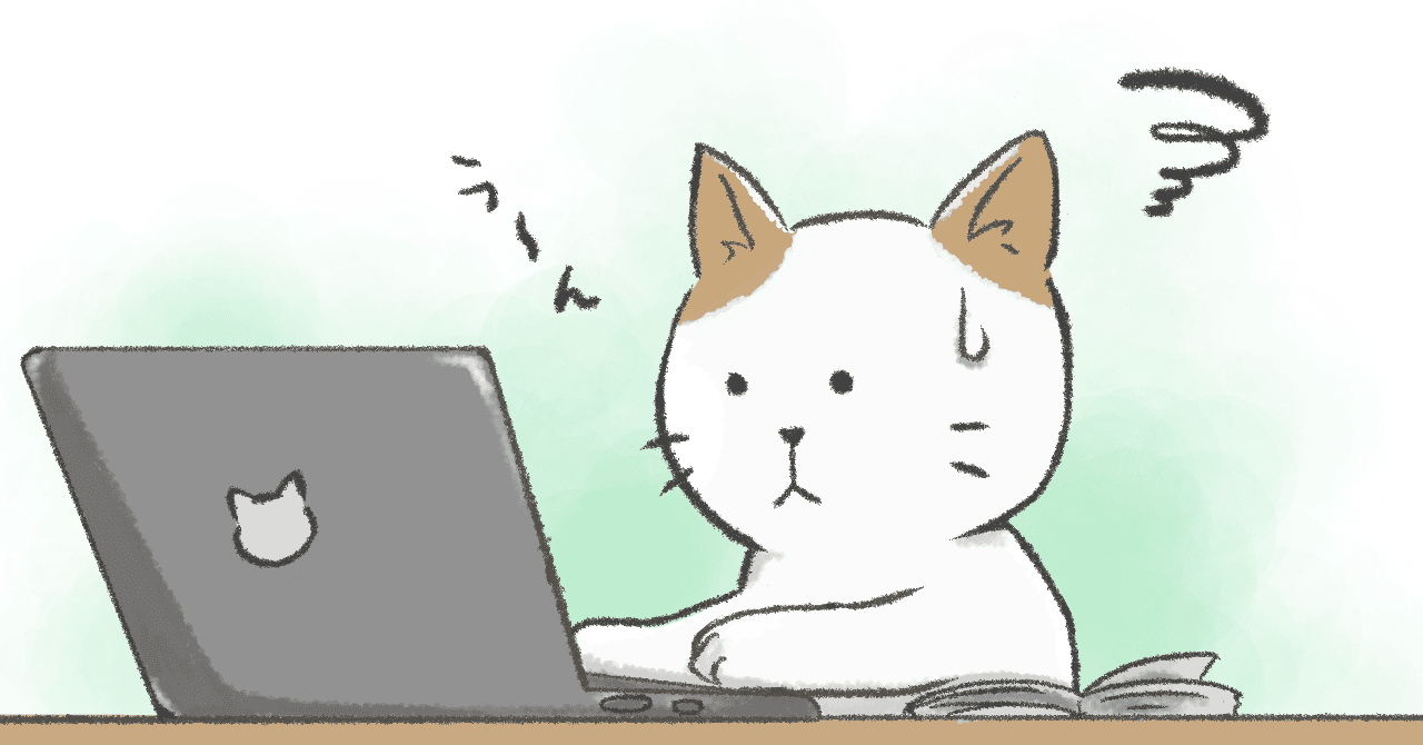 パソコンの前で困っているネコ